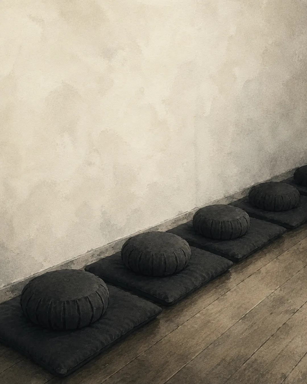 A watercolor of a row of round zafu cushions on square mats along the wall of our meditation hall.